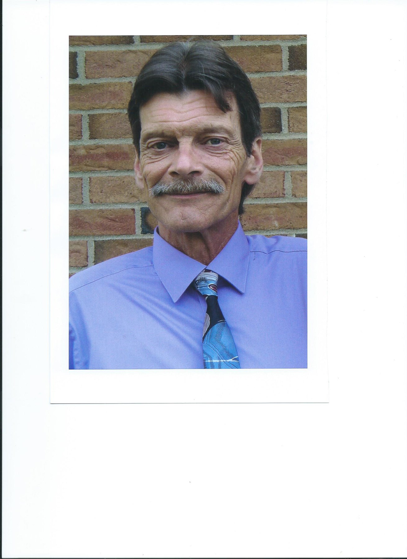 Obituary of Neland E. Cass