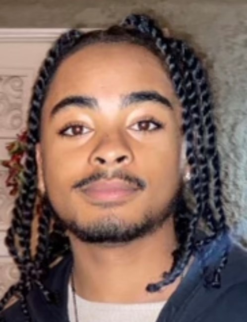 Obituary of Reginald J Rhodes