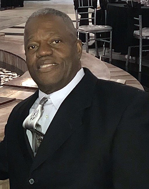 Obituario de John Edward Holmes